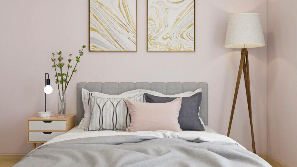 a large bed against a soft pastel wall