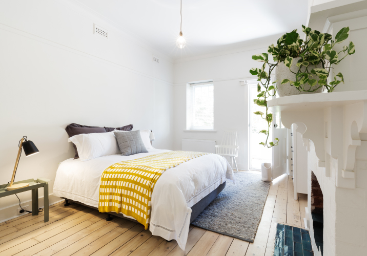 Guest bedroom with timber floorboards