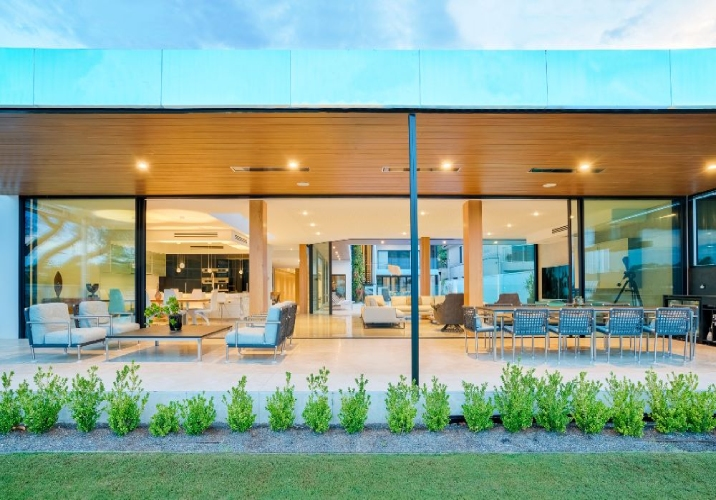 The exterior of a large one storey house showcasing indoor outdoor living