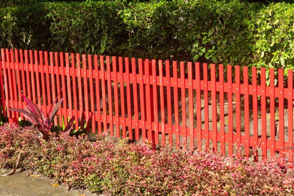 A red garden fence