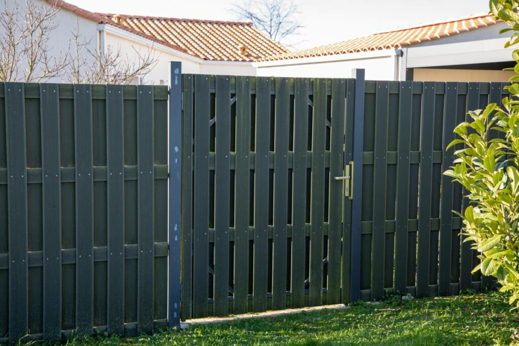 Newly painted grey wooden fence