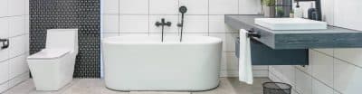 Bathroom with a white bathtub, toilet and sink