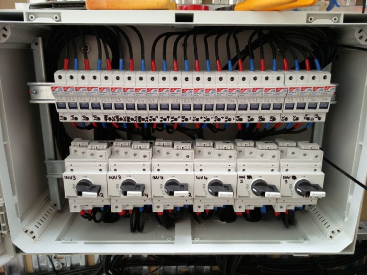 A clean white electrical box with multiple switches.