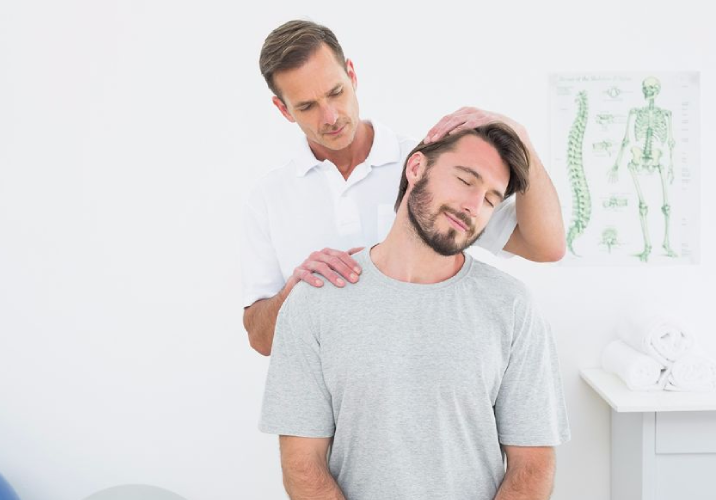 Chiropractor stretching a patient's neck