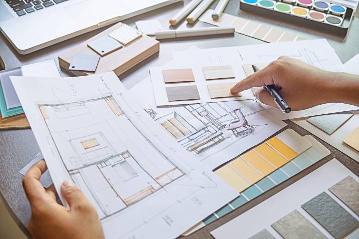 an interior designer with a sketch plan